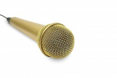 2060622-isolated-microphone-with-yellow-glitter